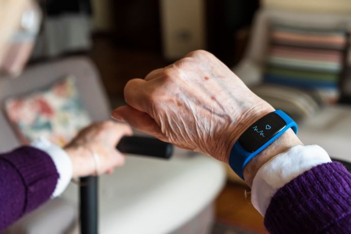 Older woman checking smartwatch showing wearable device use 