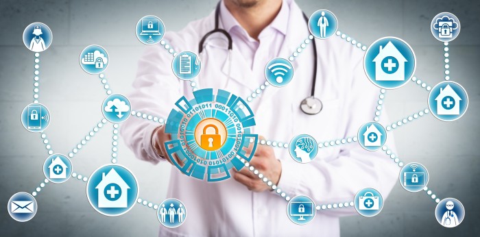 Healthcare provider pressing circle with lock on it, representing data privacy in telehealth