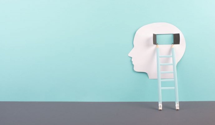 Ladder going up to a the brain of the white cutout of a head on a blue background representing behavioral healthcare