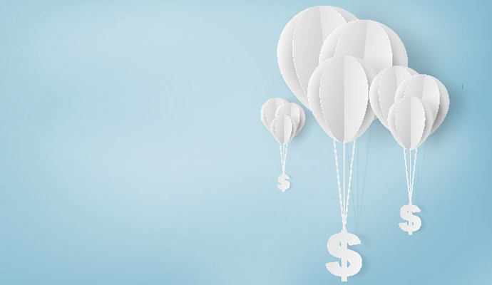 Dollar bills hanging from balloons signifying investments in virtual care