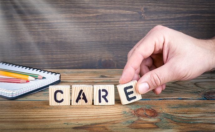 Photo of Scrabble tiles spelling CARE. Source: ThinkStock